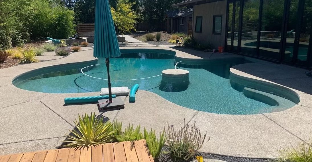 A freeform pool with a rock waterfall